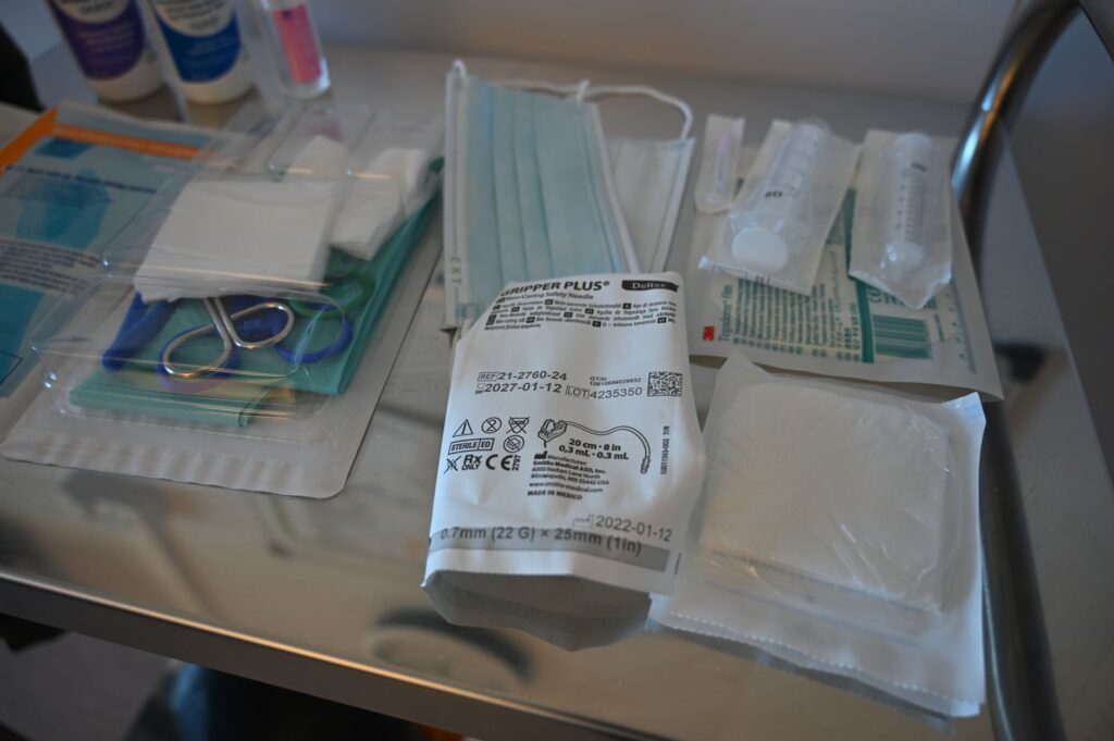 pexels photo 24193880 24193880 Close-up of various medical supplies on a sterile table in a healthcare setting.