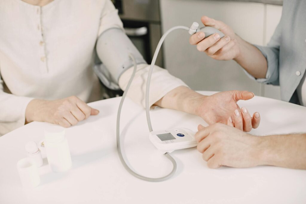pexels photo 7446776 7446776 Close-up of blood pressure measurement at home highlighting healthcare equipment.